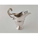 Georgian style helmet cream jug with scroll handle 4 in high, Sheffield 1919. 55gm