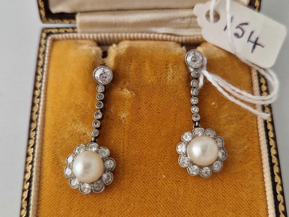 A ATTRACTIVE PAIR OF PEARL AND DIAMOND EAR PENDANTS WITH SCREW BACK FITTINGS WITH LARGE CENTRAL