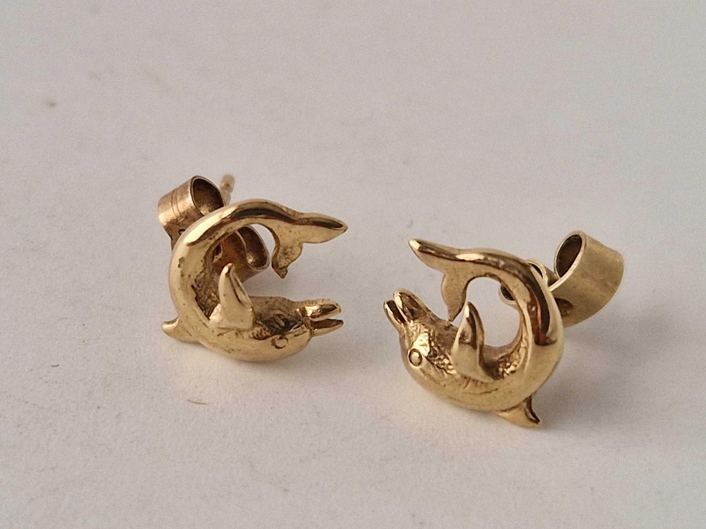 A pair of dolphin shaped earrings 9ct