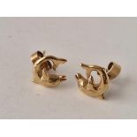 A pair of dolphin shaped earrings 9ct