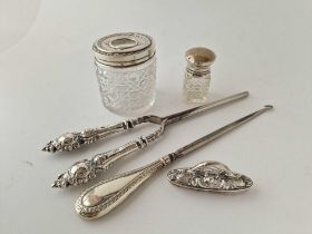 Two silver topped jars, a button hook etc