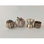 Two Eastern white metal pumpkin shaped jars and covers, a napkin ring and a French egg cup