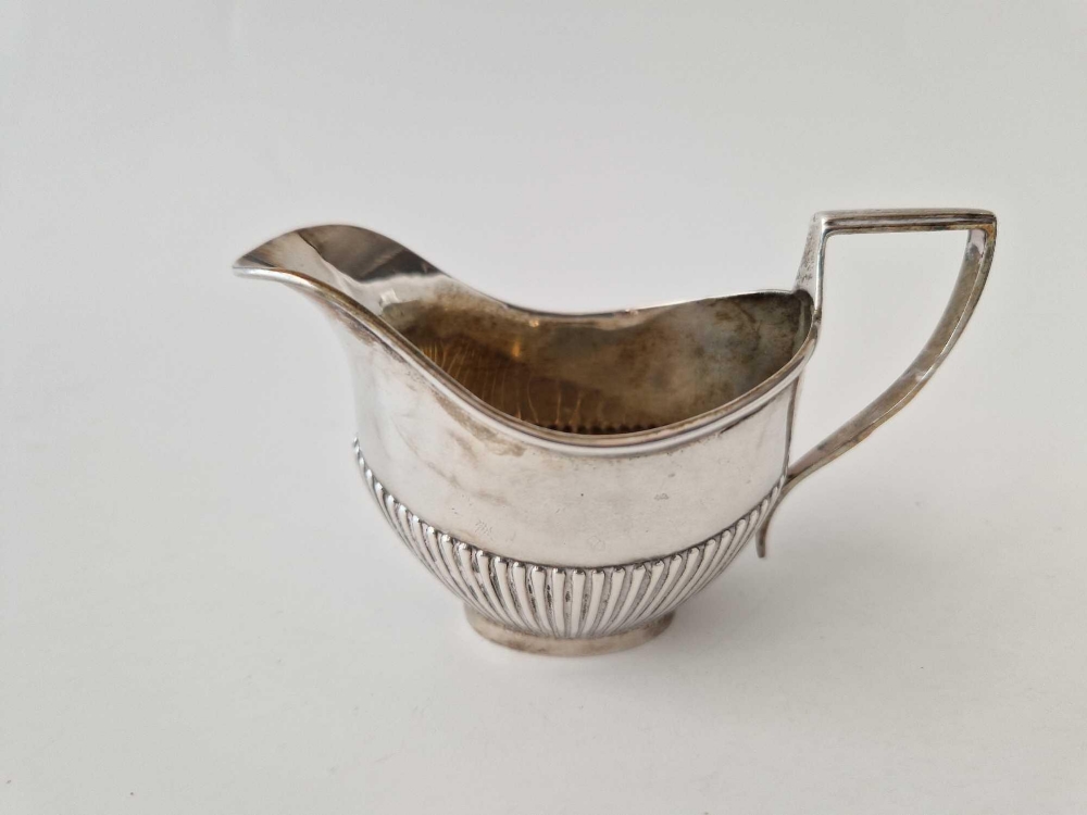 An oval half fluted small cream jug, Birmingham 1904 by WA, 42 g. - Image 2 of 2