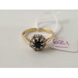 A sapphire and diamond cluster ring 18ct gold size V 4.2 gms