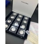 Cased set of 12 French silver proof chucrch medals with COA