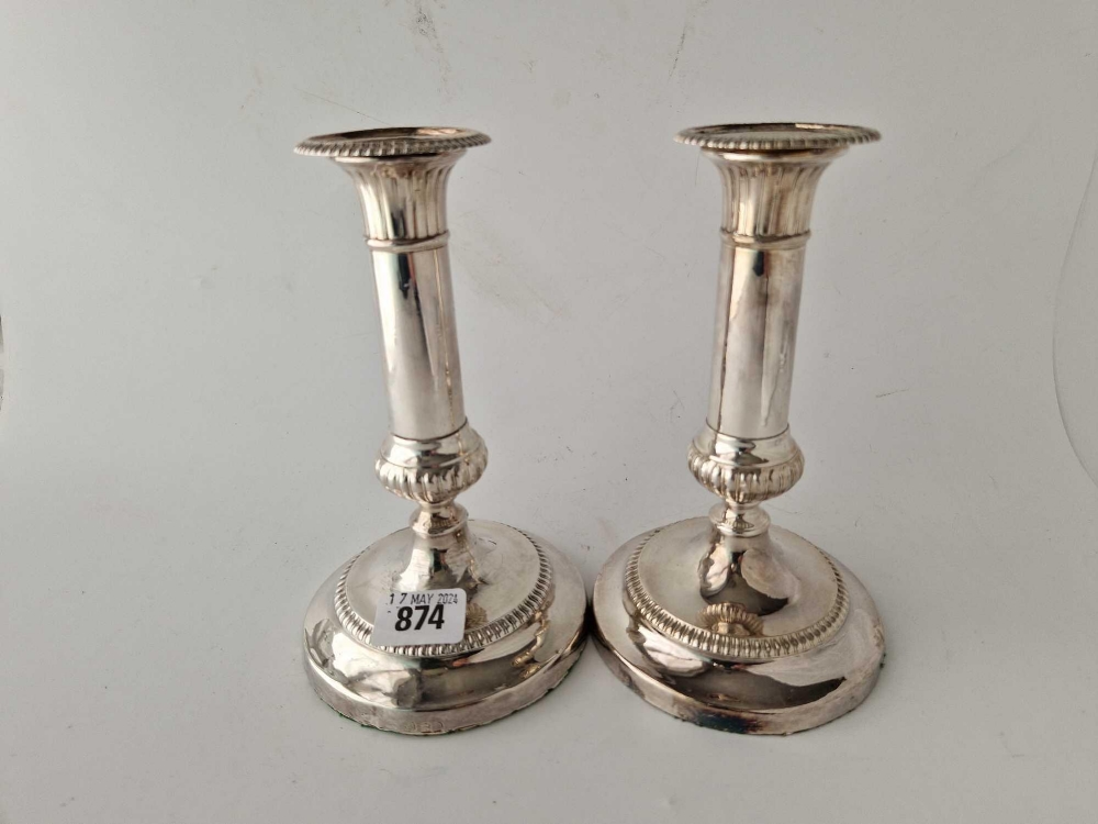 A pair of George III candlesticks with circular bases and detachable nozzels, 7.5" high, Sheffield