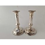 A pair of George III candlesticks with circular bases and detachable nozzels, 7.5" high, Sheffield