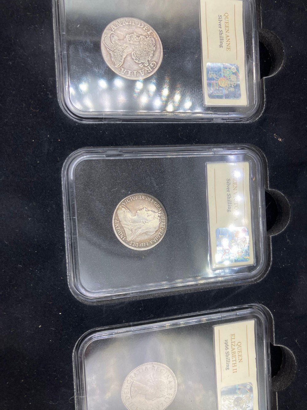 A boxed Three Queen shilling collection, The QueenAnne shilling 1711, Victoria 1898 & Elizabeth - Image 2 of 2