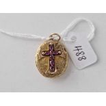 A Victorian gold locket with ruby cross design 6.6 gms