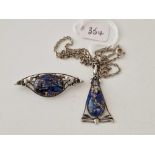 A art nouveau silver and harlequin foiled glass pendant and brooch by Thomas L Mott
