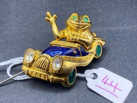 A Designer Brooch Frog Driving a fancy Enamelled Sports Car Gem Set headlights Green Cabochon Eye
