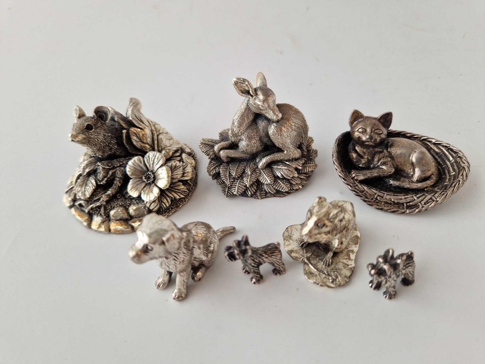 Silver mounted group of a mouse amongst foliage. 2 in high, baby deer and other white metal animals