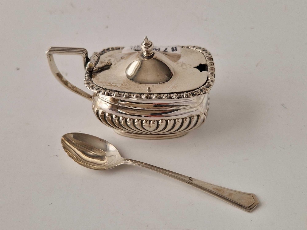 Oblong mustard pot half fluted and a tea spoon. Birmingham 1910. 60gm excl BGL chipped