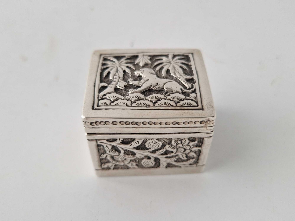 An Indian box chased with foliage and animals, 1.5 inches square, 41 g