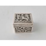 An Indian box chased with foliage and animals, 1.5 inches square, 41 g