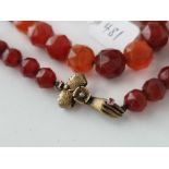 A 19TH CENTURY CARNELIAN BEAD NECKLACE WITH UNUSUAL GOLD HAND CLASP 32 INCH