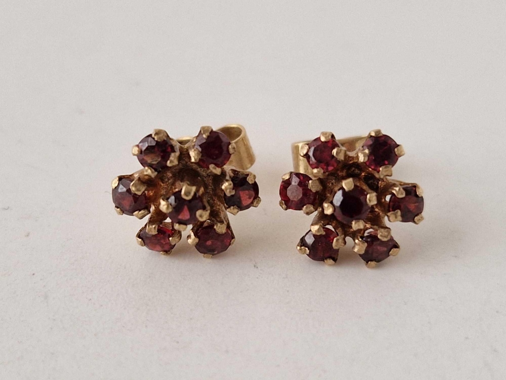 A pair of vintage garnet set cluster flower earrings 9ct