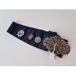 A nurses belt complete with medical badges