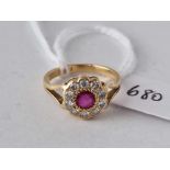 A ruby and diamond cluster ring 18ct gold size I