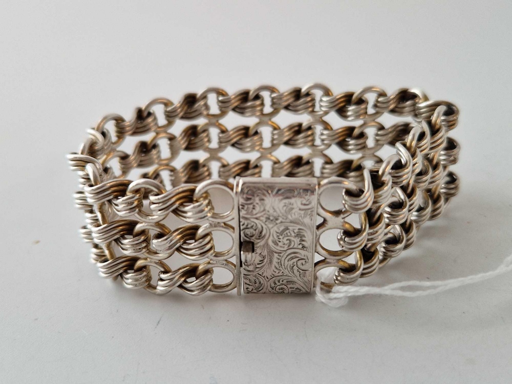 A Victorian silver wide bracelet with three row stylized knot link design substantial quality - Image 2 of 2
