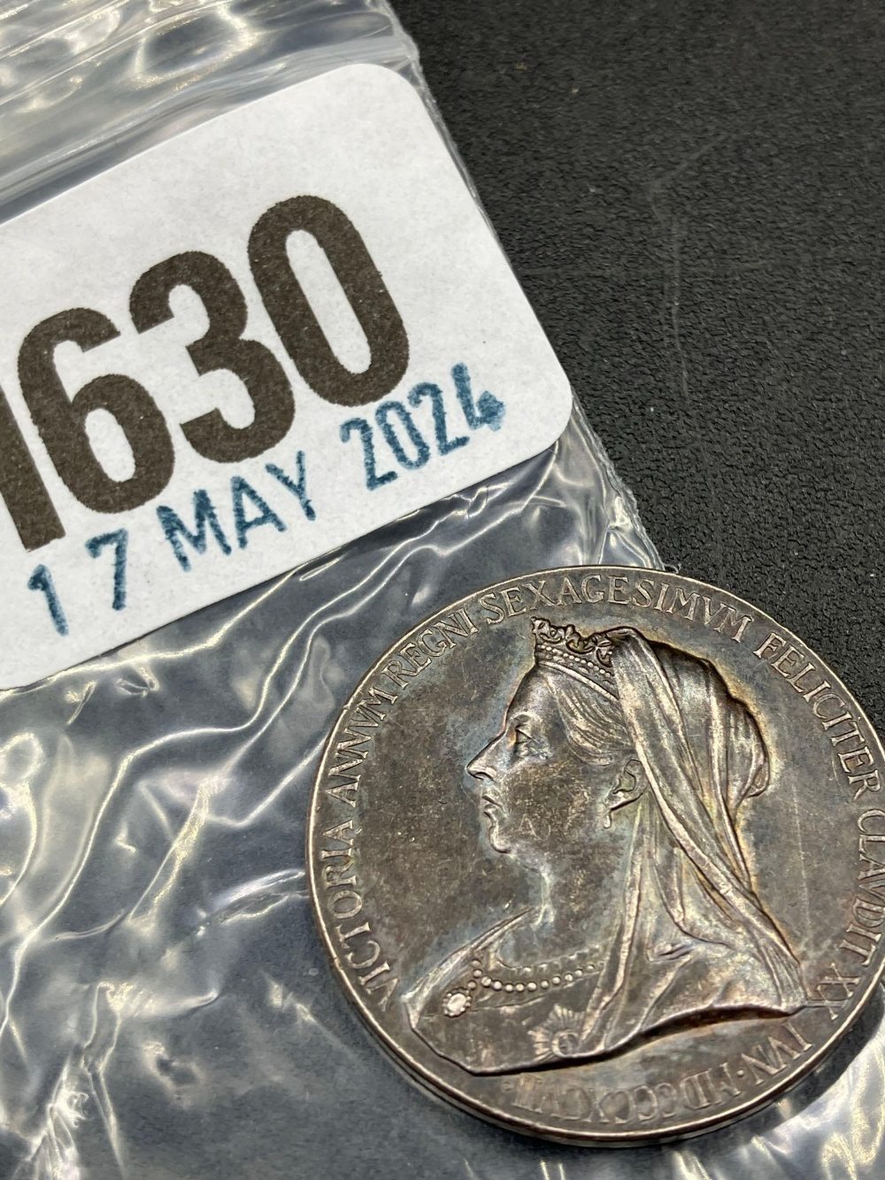 Small silver 1897 medallion