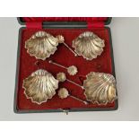 A set of four shell shaped salts with matching spoons, Chester 1899
