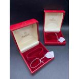 Two red OMEGA wrist watch boxes