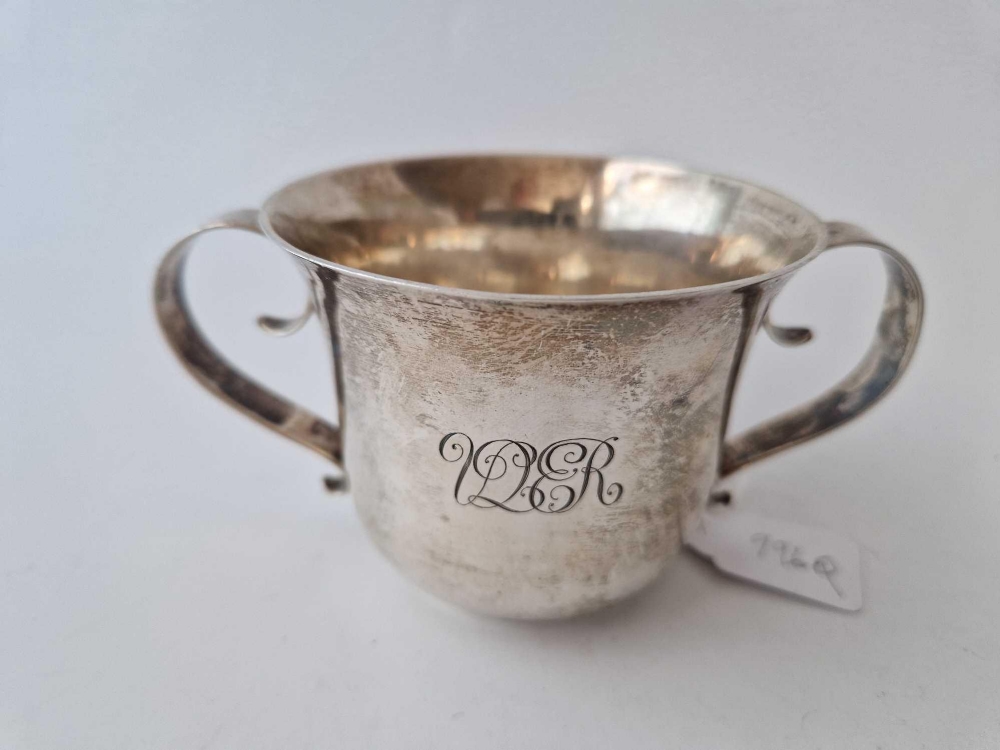 Porringer with two scroll handles . 5.5 in over handles . London 1901. 170gms