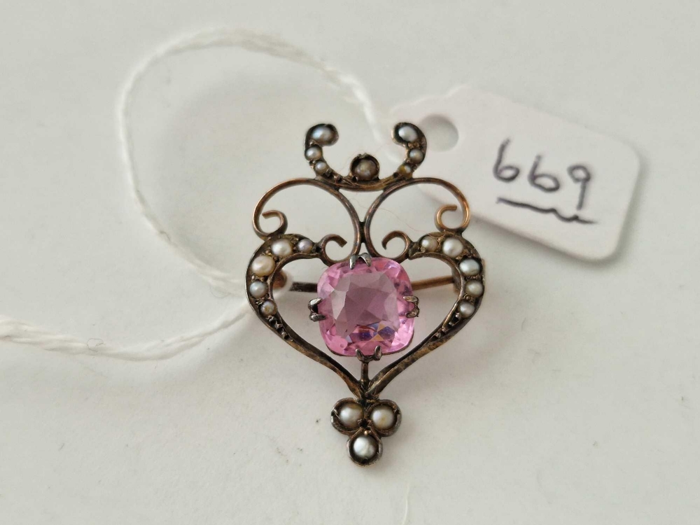 A Edwardian art nouveau gold brooch set with a pink central stone and half pearls 9ct
