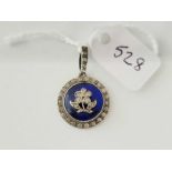 A Edwardian silver circular pendant set paste and a blue enamel centre