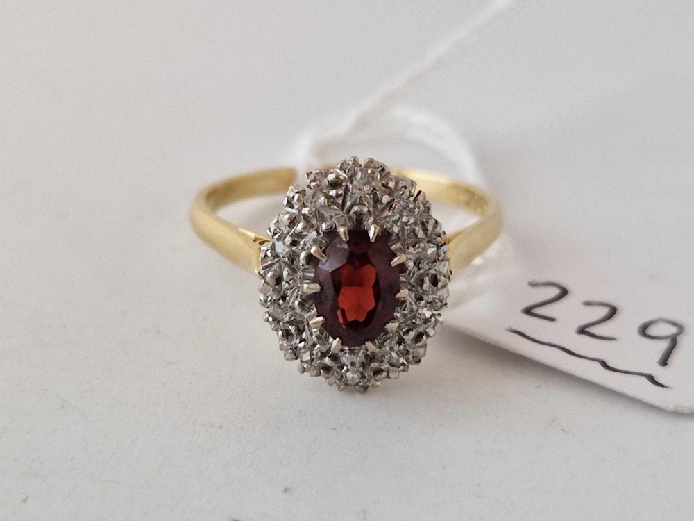 A RUBY AND DIAMOND CLUSTER RING 18CT GOLD SIZE S 4.6 GMS