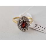 A RUBY AND DIAMOND CLUSTER RING 18CT GOLD SIZE S 4.6 GMS