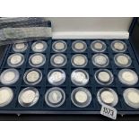 Cased set of 24 silver world coins with COA