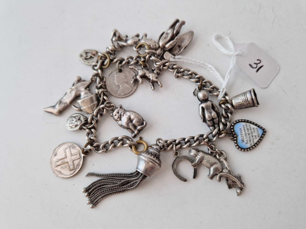 A silver charm bracelet 41.9 gms