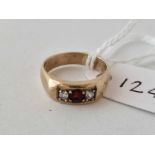A garnet and white stone gypsy set ring 9ct size I 3.2 gms