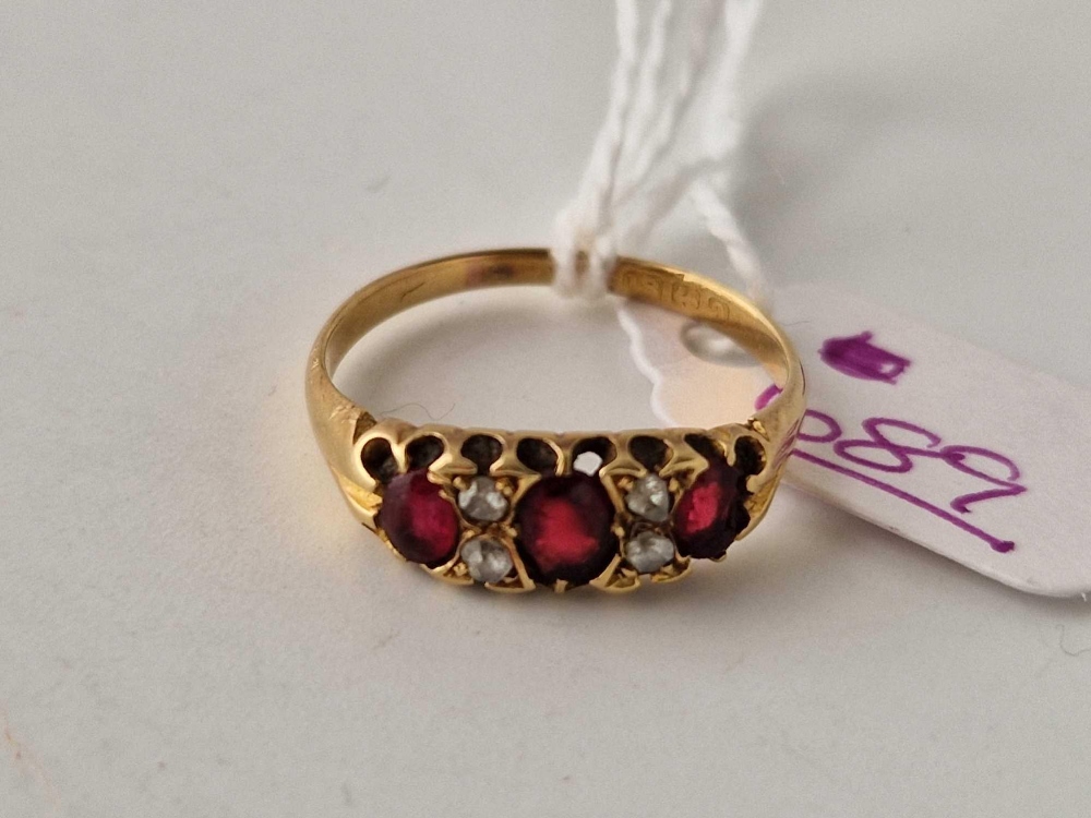 A antique garnet and diamond ring 18ct gold size P 2.8 gms