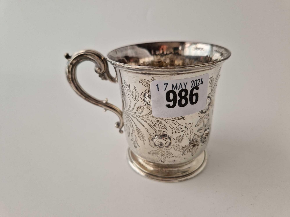 A Victorian Christening mug engraved and chased with flower mottifs,3" high, London 1853 by EB & JB,