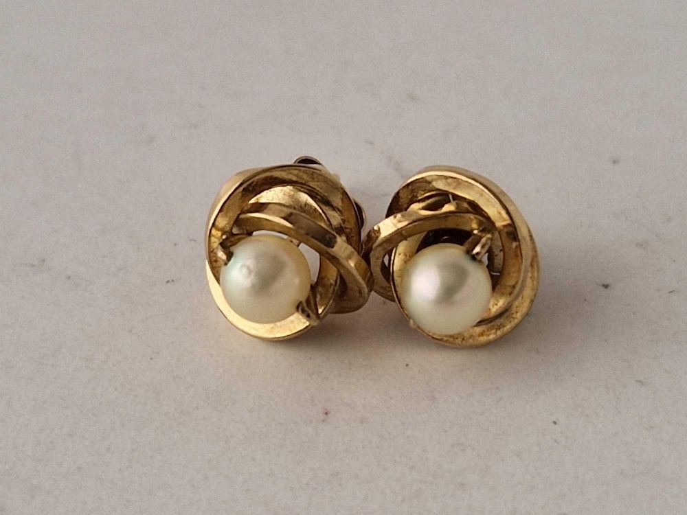 A pair of pearl stud earrings 9ct