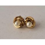 A pair of pearl stud earrings 9ct