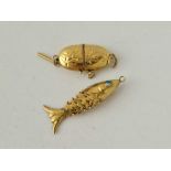 Two antique gold charms 14ct gold an articulated fish with blue eyes and a spectacles case