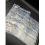 Two sheets of coins including 9 £5 coins