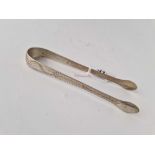 A pair of George III bright cut sugar tongs, circa 1800, 25 g