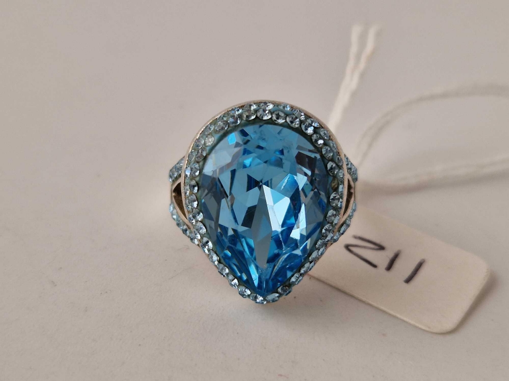 A silver blue stone dress ring