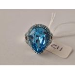 A silver blue stone dress ring