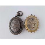 Two oval lockets one gilt inset with stones AF the other locket silver