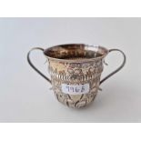 Early George III two handled cup of William and Mary design. 5 in over handles. London 1763 By W