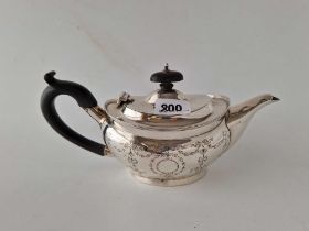 Chester silver oval teapot engraved with drooped festoons. 9 in long 1913. 303gm
