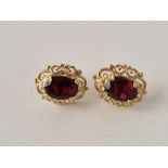 A pair of garnet stud earrings 9ct 1.7 gms