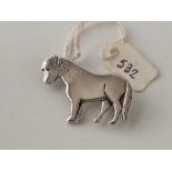 A solid silver pony brooch