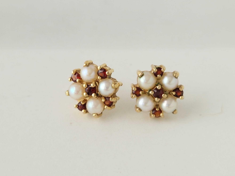 A pair of pearl and garnet ear studs 9ct 2.5 gms